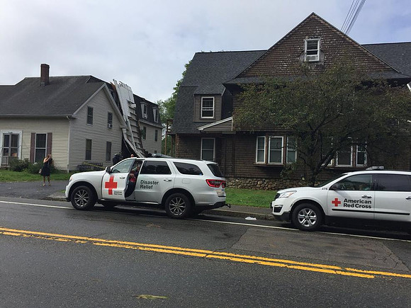 Red Cross at the scene in Upton, Massachusetts, where a porch was ripped away from a multi-family home