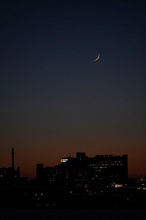 Thin cresent moon over RI Hospital, India Point Park copyright ronaldzinconephotography