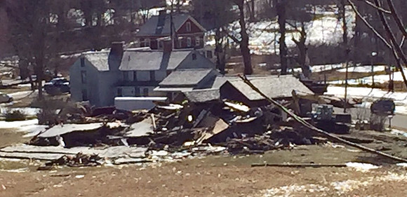 Looking down at tornado damage to homes on Whately Rd. Conway, MA