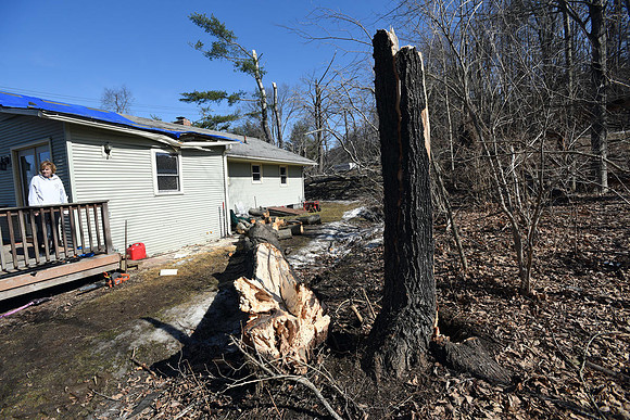 Jeanie Thomas had major tree, roof and car damage