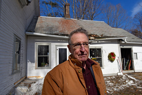 Grant Ingle had window and roof damage on his house