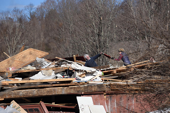 John Maggs searches through his barn which was built in 1868 and housed thousands of antiques.