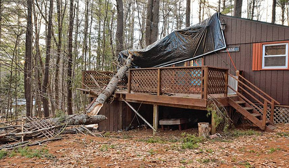Fallen pine tree damaged this seasonal home at 44 Pine Road in Goshen