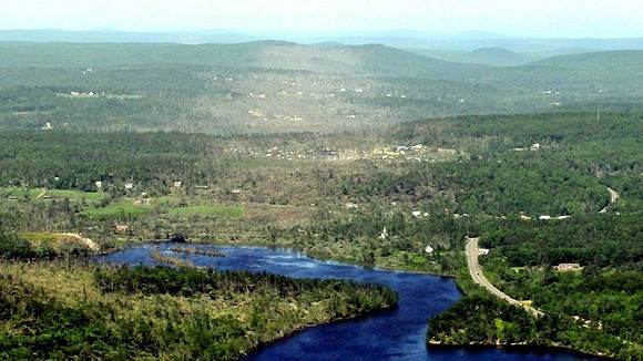 Monson aforest land shows the path of destruction by the tornado late Wednesday afternoon