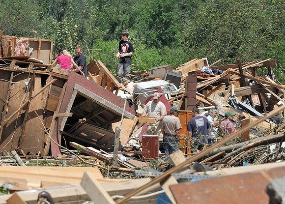 Residents worked to salvage what was left of a horse barn and apartment on Hollow Rd
