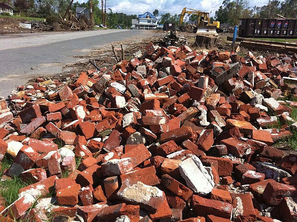 Bricks that once were buildings litter the tornadoes path
