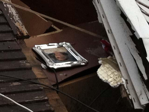 A photo is seen in the debris.