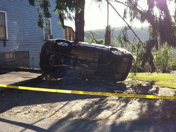An overturned car in Monson