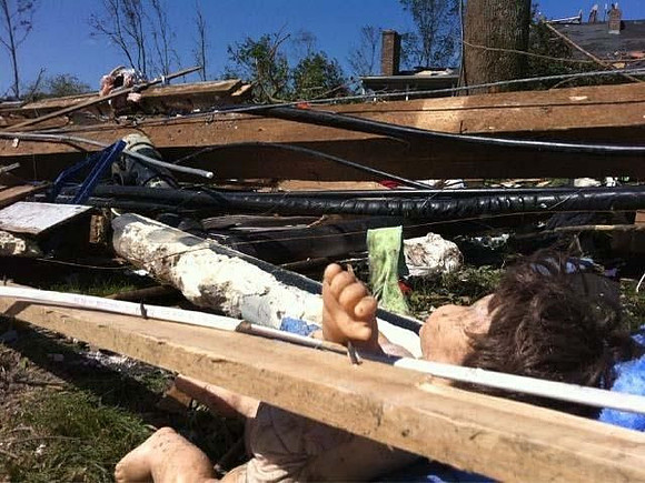 A child's doll is seen in the debris in Monson