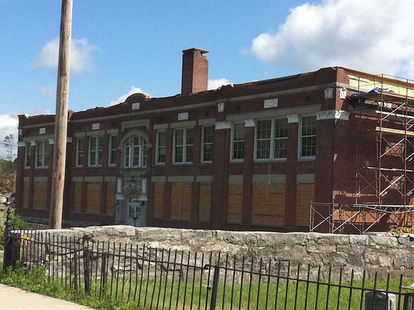 This Monson building sustained major damage in the storm, but was still standing.