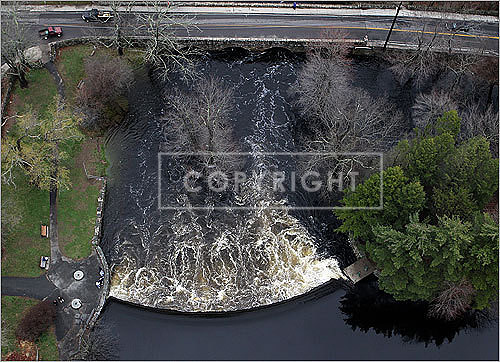 The overflow of the Natick Dam by Route 16.
