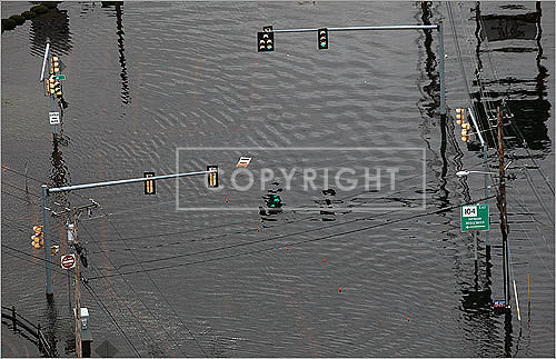 There was no traffic Wednesday at the flooded intersection of Routes 104 and 44 in Taunton.