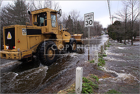 A front end loader worked on Narrows Road in Freetown