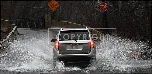 A truck barreled through water on Pelham Island Road in Wayland.