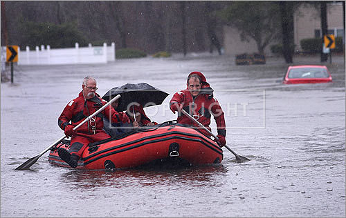 In Cranston, R.I., firefighters traded the truck for a raft to help evacuate residents. About 135 homes were evacuated from the rising waters for the Pawtuxet River.