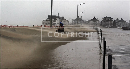 Sand from Hampton Beach blew onto a parking lot.