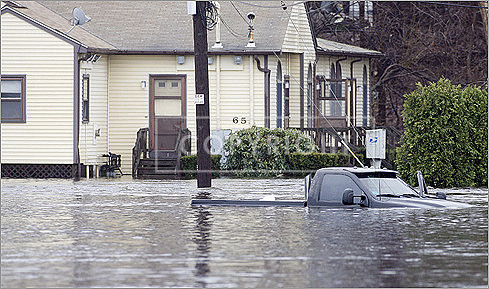 An abandoned truck in flood water on Industrial Lane in West Warwick, R.I