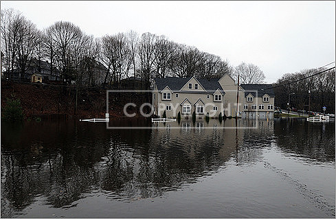 Flood damage on Tuesday along Riverbank Road in Attleboro.