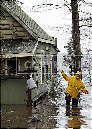 Lee Ann Tavares checked flood damage to her seasonal home on Long Pond in Lakeville