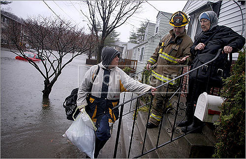 Cranston firefighter Chris Lyshawa evacuated Cindy Phillips and Tina Galoski from their home on Fordson Avenue.