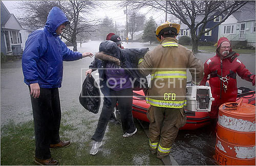 Cranston firefighters evacuated the Butlers -- along with their cat -- from their home by raft.