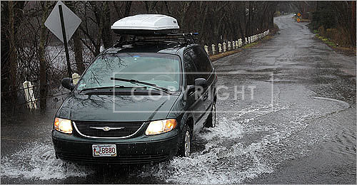 A flooded Pelham Island Road in Wayland.