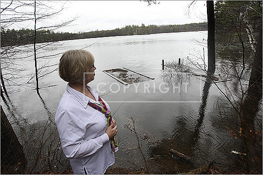 The docks of the home on Spectacle Pond that Deborah Crane rents were submerged and in danger of washing away.