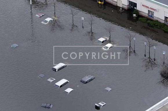 Floodwaters of the Pawtuxet River surround abandoned cars outside the Warwick Mall in Warwick, R.I.
