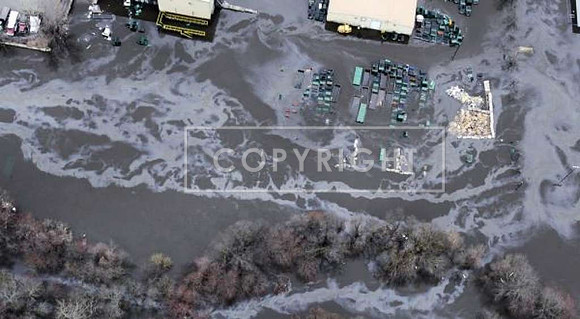 Oil slick runs through an industrial area of the Pawtuxet River in Warwick, R.I.
