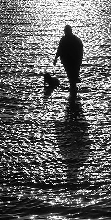 Human silouhette at Rock Harbor ocopyright ronaldzinconephotographyn water