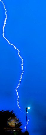 Cloud to ground lightning hits light pole  copyright ronaldzinconephotography