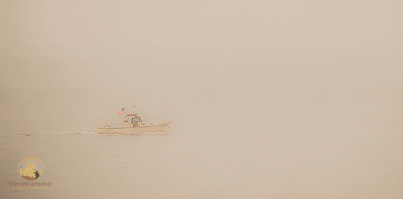 Boat with American flag  copyright ronaldzinconephotography