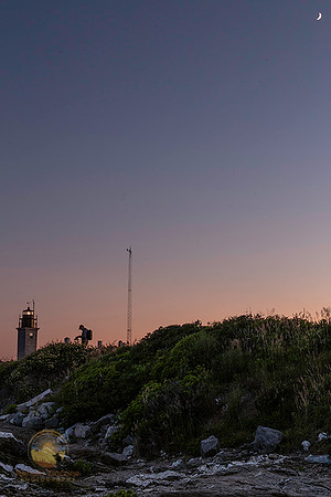 Crescent moon over Beavertail lighthouse copyright ronaldzinconephotography