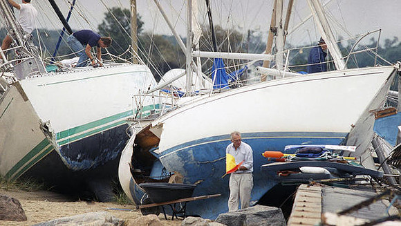 Boat owners gather their belongings, Aug. 20, 1991 in Dartmouth, Mass., after Hurricane Bob swept through southern Massachusetts
